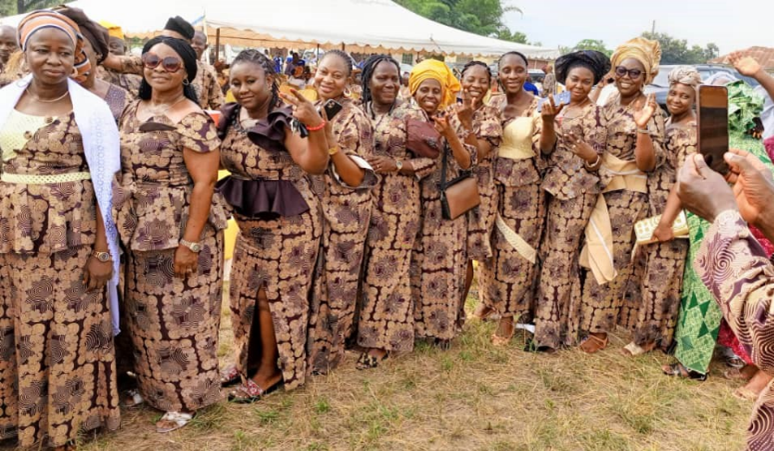 Women wearing asoebi with no portraits and text
